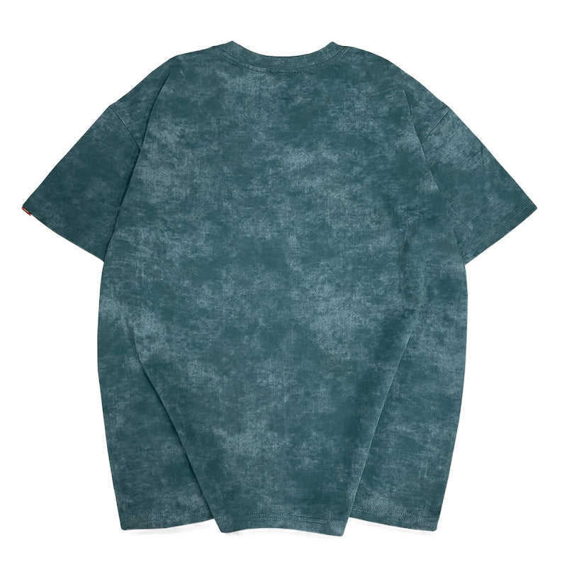 Christian – T-shirt à col rond brodé manches courtes délavé