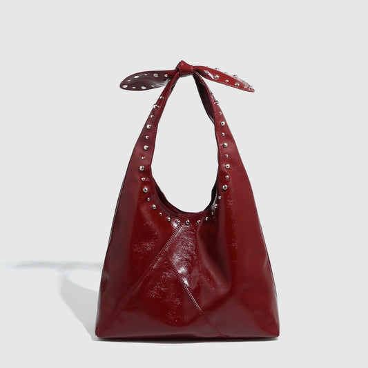 Leah – Sac Seau pour Femme avec Rivets et Nœud