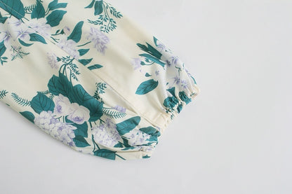 Zoe – Combinaison décontractée à fleurs avec ceinture